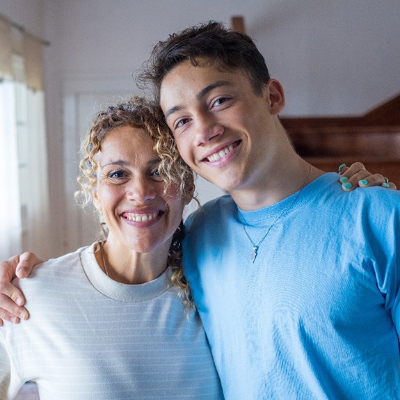 Smiling mom and her teen son