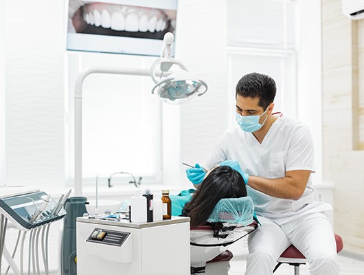 Dentist working on patient