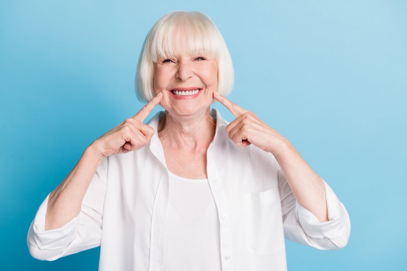 older woman smiling with dental implants